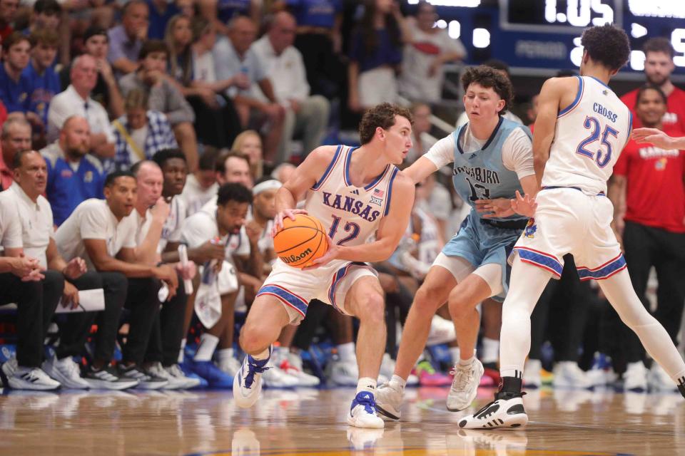 Kansas basketball guard Wilder Evers (12) guards the ball from Washburn in the second half of a game inside Allen Fieldhouse on Oct. 29, 2024.