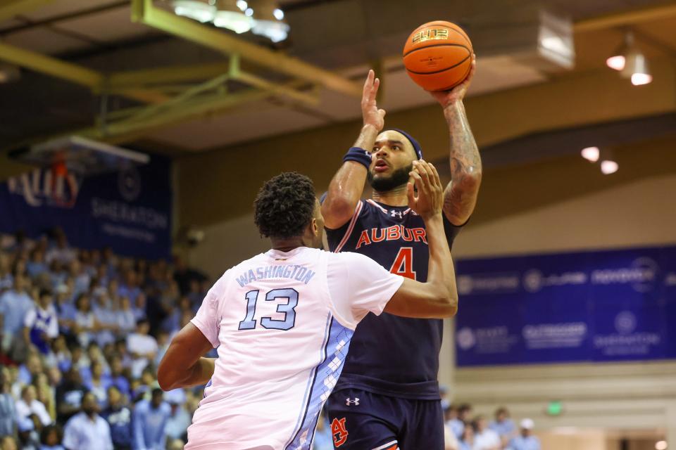 LAHAINA, HAWAII - NOVEMBER 26: Johni Broome #4 of the Auburn Tigers shoots over Jalen Washington #13 of the North Carolina Tar Heels during the second half of the Maui Invitational at the Lahaina Civic Center on November 26, 2024 in Lahaina, Hawaii. (Photo by Darryl Oumi/Getty Images)