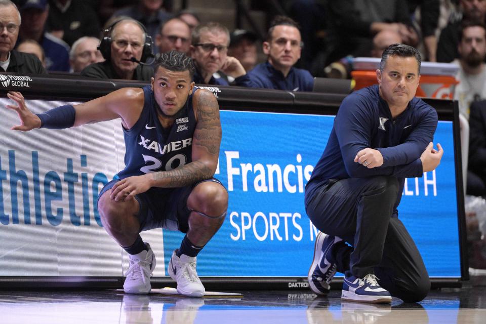 Dayvion McKnight (left) was a double-digit scorer last season for Xavier and was sixth in the Big East in assists.