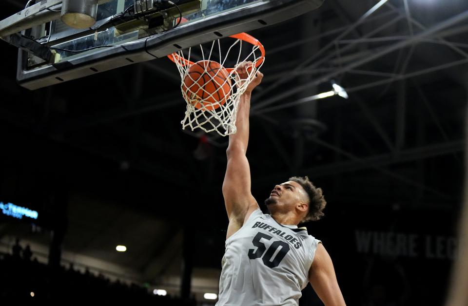 Dec 30, 2024; Boulder, Colorado, USA; Colorado Buffaloes center Elijah Malone (50) finishes off a basket in the second half against the Iowa State Cyclones at CU Events Center. Mandatory Credit: Ron Chenoy-Imagn Images