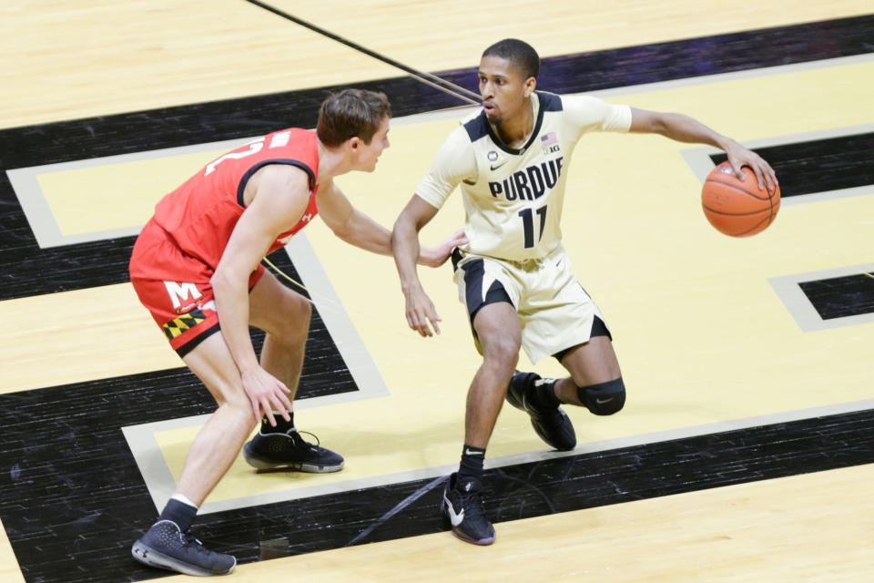 Purdue guard Isaiah Thompson (11) dribbles against Maryland guard Reese Mona (12) during the second half of an NCAA men's basketball game, Friday, Dec. 25, 2020 at Mackey Arena in West Lafayette.