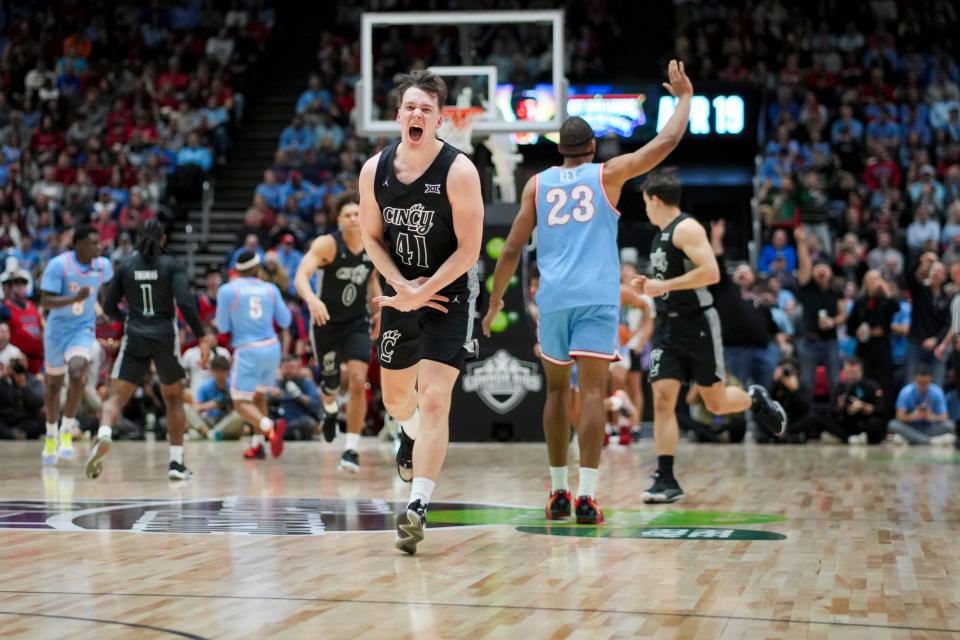 Dec. 20: Cincinnati guard Simas Lukosius (41) celebrates after making a 3-point shot against Dayton.