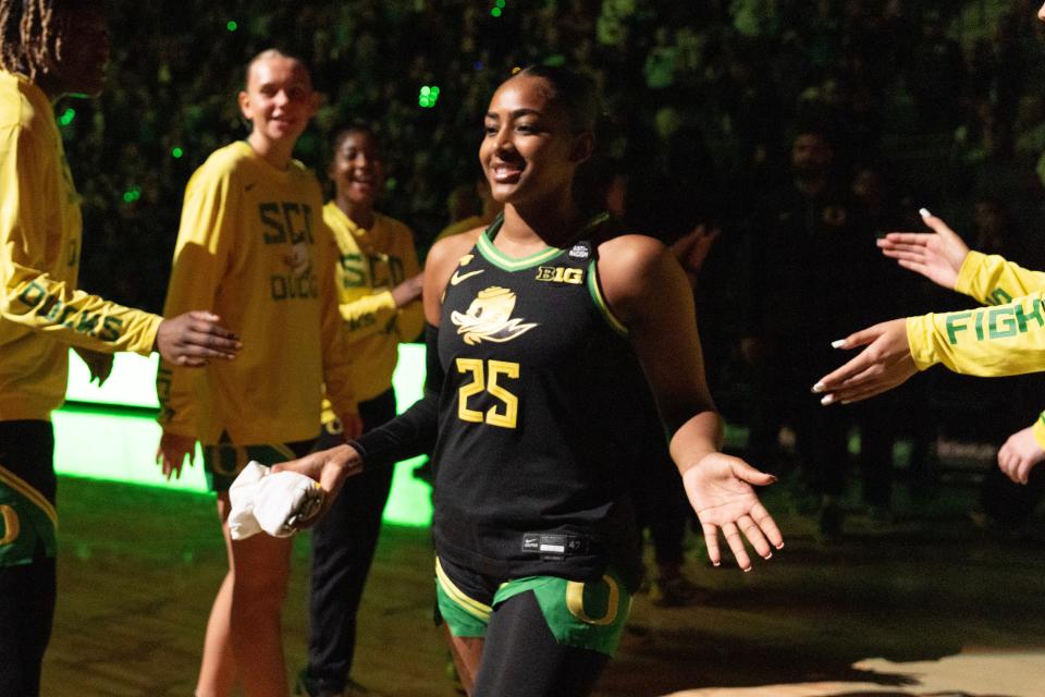 Oregon’s Deja Kelly, center, takes the floor during team introductions at Matthew Knight Arena in Eugene.