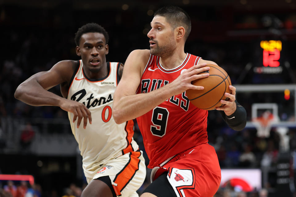 DETROIT, MICHIGAN - NOVEMBER 18: Nikola Vucevic #9 of the Chicago Bulls tries to get around Jalen Duren #0 of the Detroit Pistons during the second half at Little Caesars Arena on November 18, 2024 in Detroit, Michigan. Chicago won the game 122-112. NOTE TO USER: User expressly acknowledges and agrees that, by downloading and or using this photograph, User is consenting to the terms and conditions of the Getty Images License. (Photo by Gregory Shamus/Getty Images)