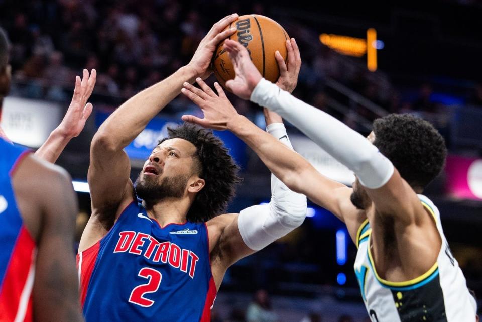 Jan 29, 2025; Indianapolis, Indiana, USA; Detroit Pistons guard Cade Cunningham (2) shoots the ball while Indiana Pacers guard Tyrese Haliburton (0) defends in the second half at Gainbridge Fieldhouse. Mandatory Credit: Trevor Ruszkowski-Imagn Images